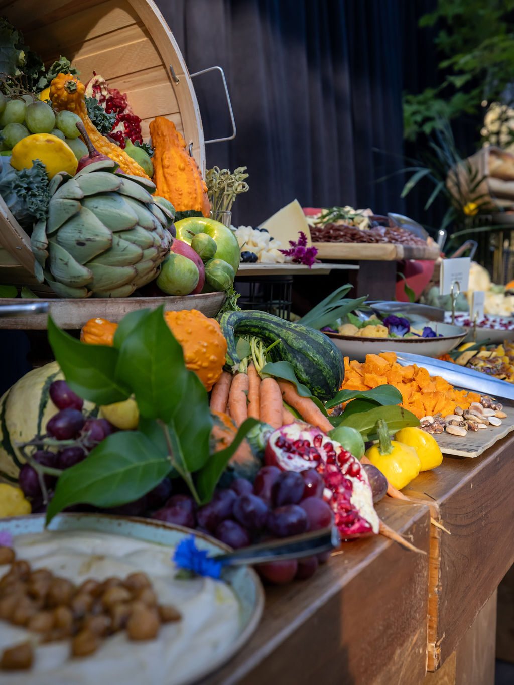 The harvest table of squash, artichokes and pomegranate