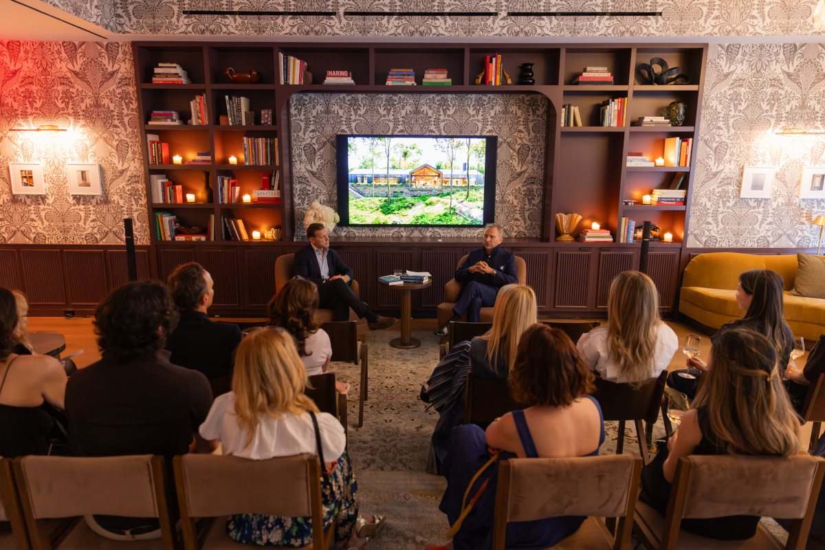 A presentation in a wood-panelled library room